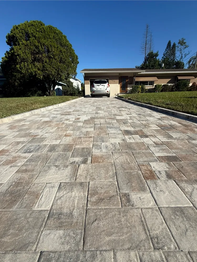 Patterned concrete paver driveway leading to the street